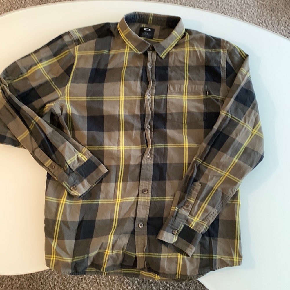 Oakley button down plaid shirt. Size XL.